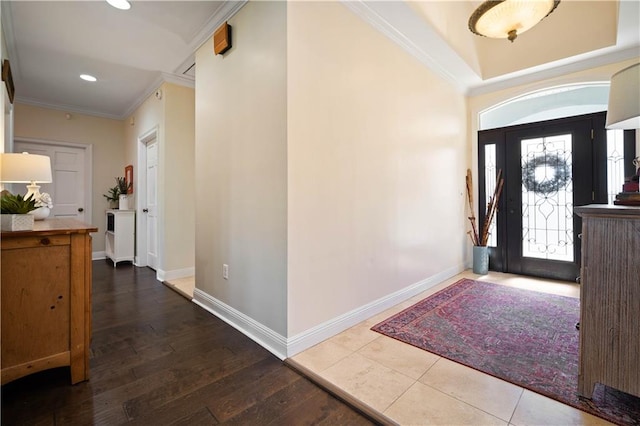 foyer featuring hardwood / wood-style flooring and ornamental molding