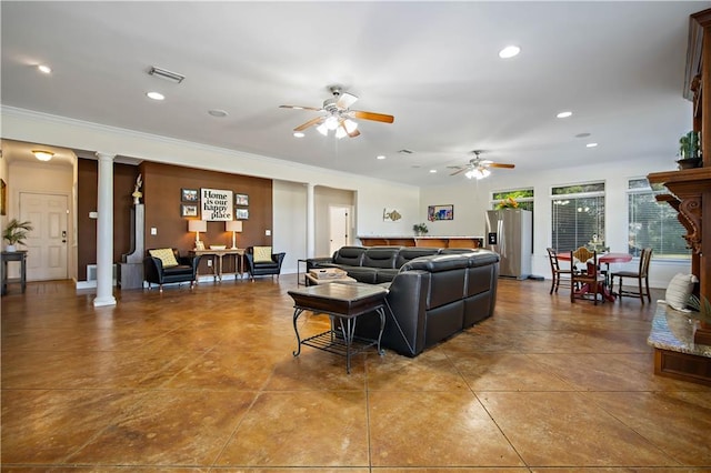 living room featuring ornate columns, ceiling fan, and ornamental molding