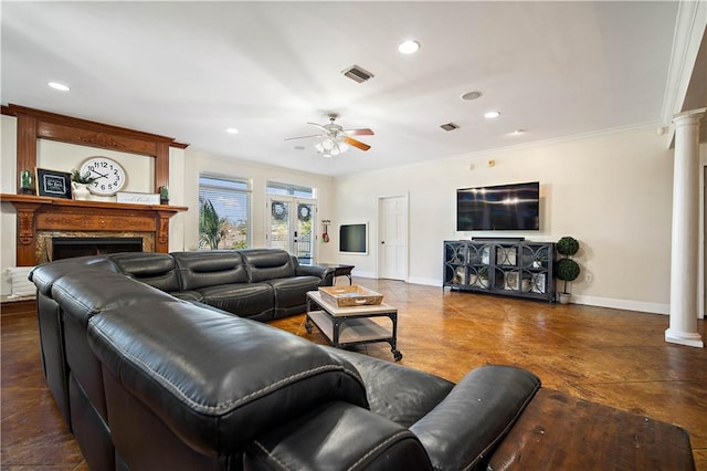 tiled living room with ornate columns, ceiling fan, and crown molding