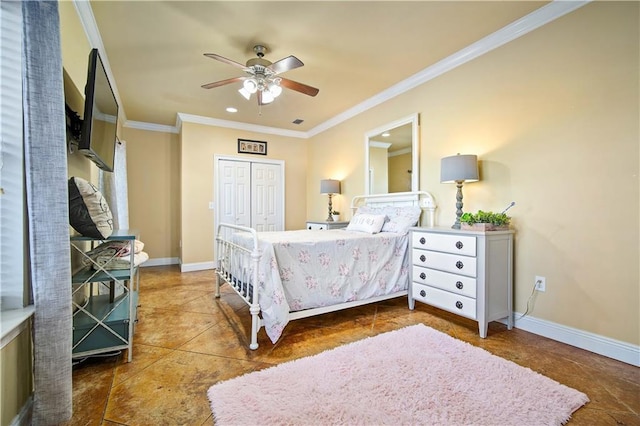 bedroom with ceiling fan, a closet, and crown molding