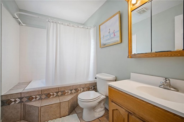 full bathroom with tile patterned flooring, vanity, shower / bath combo, and toilet