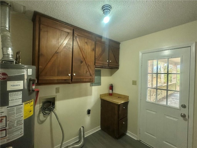 laundry area featuring gas water heater, cabinets, a textured ceiling, dark hardwood / wood-style floors, and hookup for an electric dryer