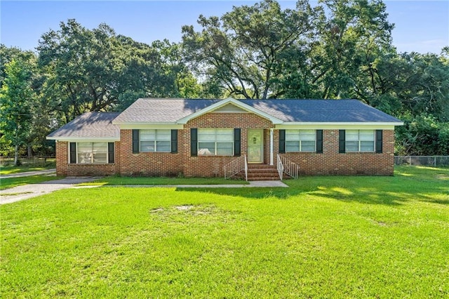 ranch-style house with a front lawn