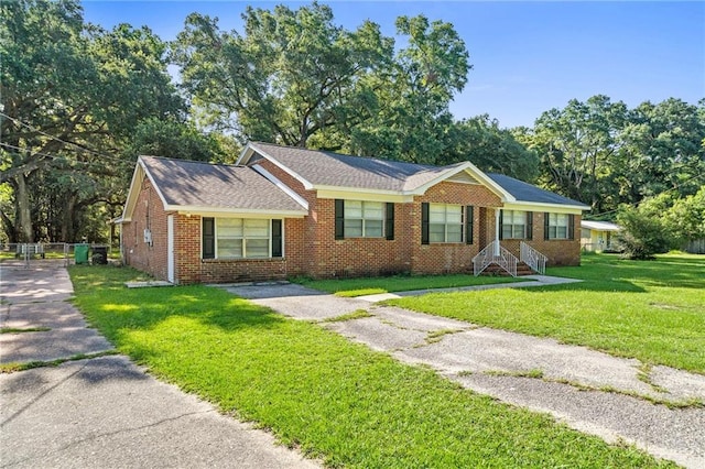 ranch-style house featuring a front lawn