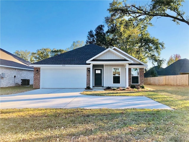8621 Grelot Rd, Mobile, AL 36695 - view of front of property featuring brick siding, an attached garage, concrete driveway, and cooling unit