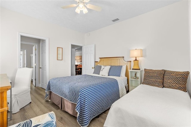 bedroom with wood finished floors and ceiling fan