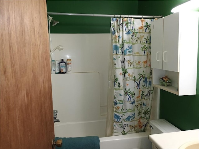 full bathroom featuring vanity, shower / bath combination with curtain, and toilet