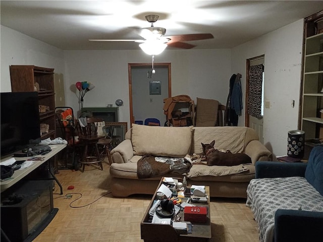 living room with ceiling fan and light parquet floors