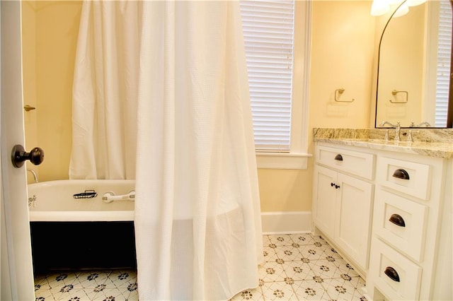 211 Cedar St, Mobile, AL 36602 - full bath with vanity, a tub to relax in, tile patterned floors, and a shower with curtain