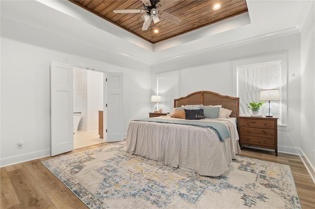 3699 Elysian Fields Dr, Saraland, AL 36571 - bedroom with a raised ceiling, wood ceiling, baseboards, wood finished floors, and ensuite bath