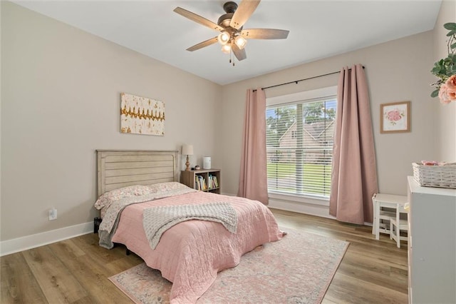 3699 Elysian Fields Dr, Saraland, AL 36571 - bedroom featuring wood finished floors, baseboards, and a ceiling fan