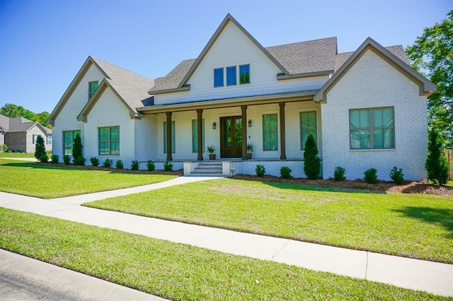 3699 Elysian Fields Dr, Saraland, AL 36571 - view of front of home with covered porch, brick siding, a front lawn, and roof with shingles