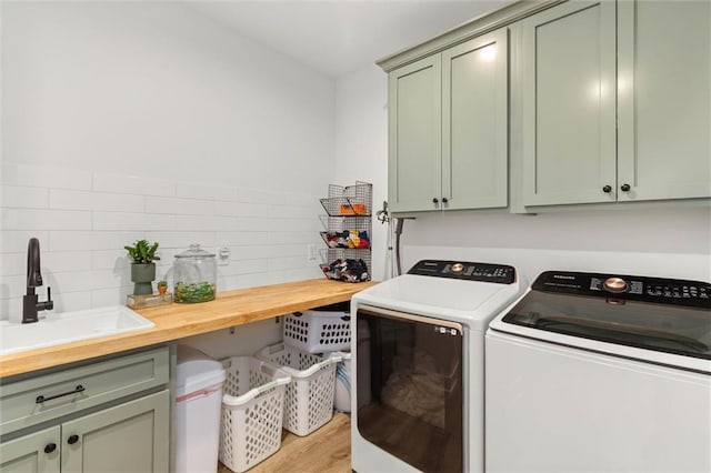 3699 Elysian Fields Dr, Saraland, AL 36571 - laundry room featuring cabinet space, washer and dryer, and light wood finished floors