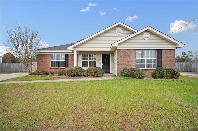 ranch-style house featuring a front lawn