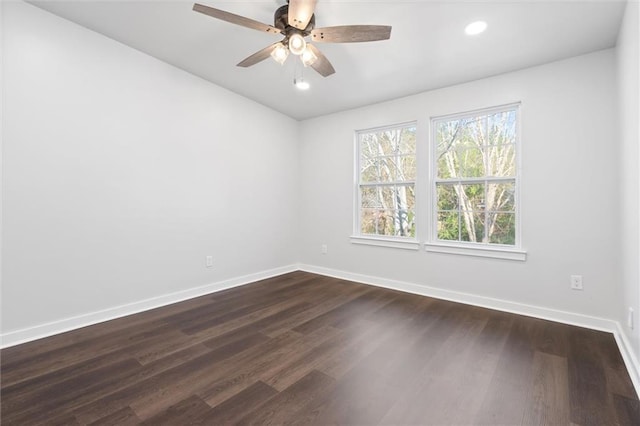 empty room with recessed lighting, ceiling fan, dark wood-type flooring, and baseboards