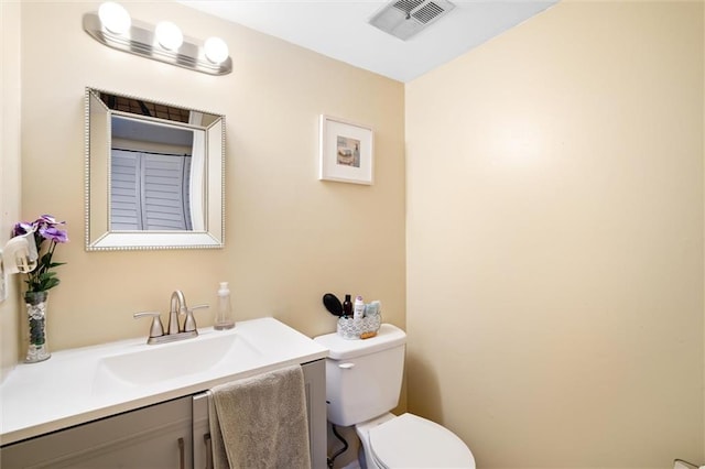 bathroom with oversized vanity and toilet