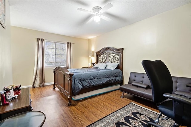 bedroom with ceiling fan and light hardwood / wood-style flooring