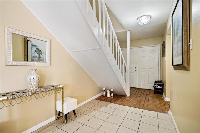 entrance foyer with light tile floors