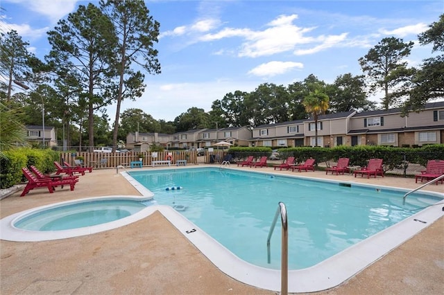 view of pool featuring a community hot tub