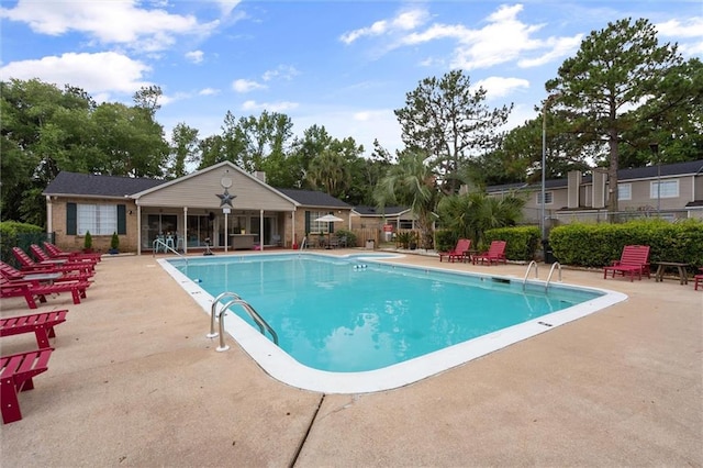 view of swimming pool featuring a patio