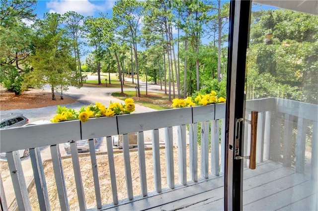 204 Golf Ter Unit 204, Daphne, AL 36526 - wooden deck featuring view of wooded area