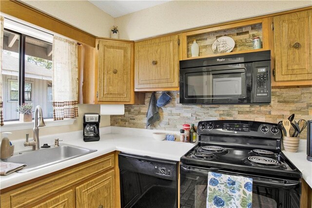 204 Golf Ter Unit 204, Daphne, AL 36526 - kitchen with black appliances, a sink, light countertops, and backsplash
