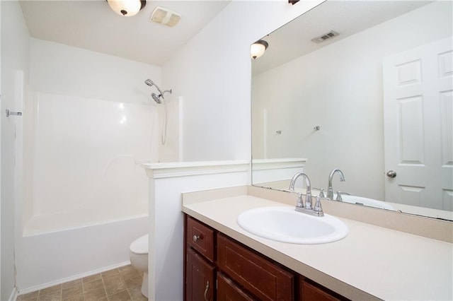 full bathroom with toilet, visible vents, shower / washtub combination, and vanity