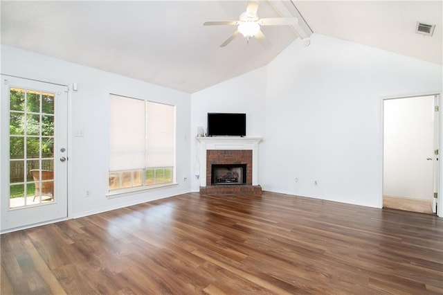 unfurnished living room with beamed ceiling, visible vents, and wood finished floors