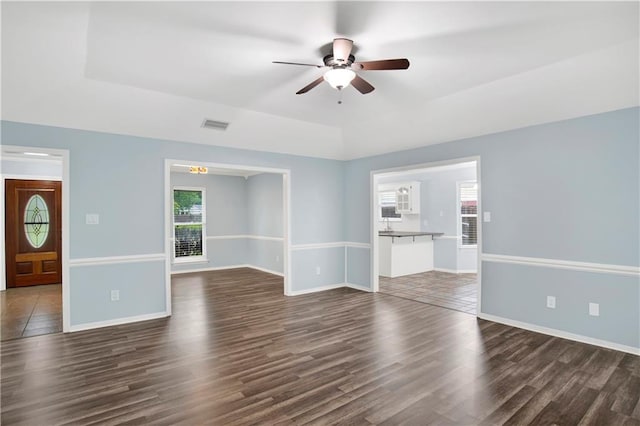 3011 Olde Gate Rd, Mobile, AL 36695 - unfurnished living room featuring a ceiling fan and dark wood-style floors