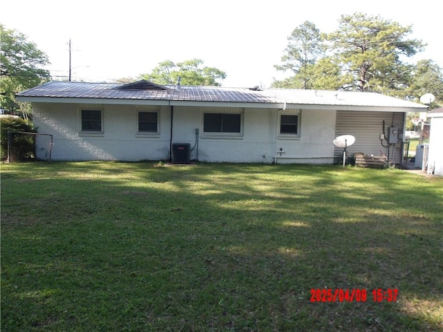 1500 Knob Hill Dr, Mobile, AL 36693 - rear view of property with a yard, central AC, brick siding, and metal roof