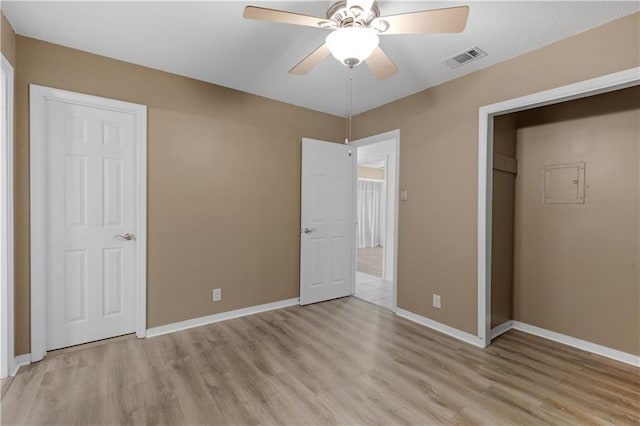 unfurnished bedroom featuring visible vents, baseboards, light wood-type flooring, and ceiling fan