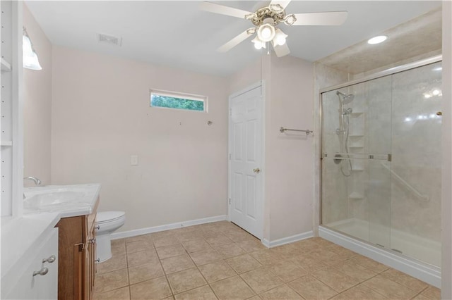 full bathroom featuring vanity, baseboards, a stall shower, a ceiling fan, and toilet