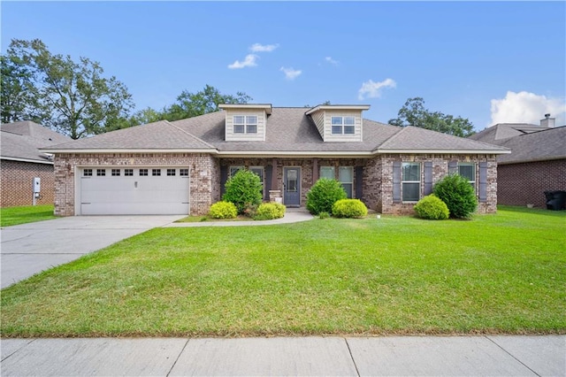 view of front of home with a garage and a front yard