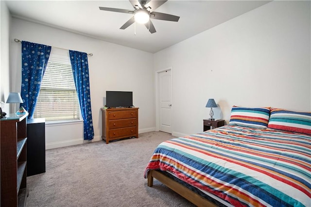 bedroom with baseboards, ceiling fan, and carpet
