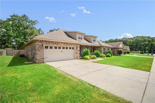 view of front of property featuring cooling unit, brick siding, a front yard, and driveway