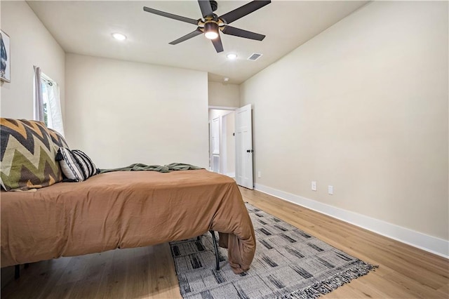 bedroom with ceiling fan and wood-type flooring