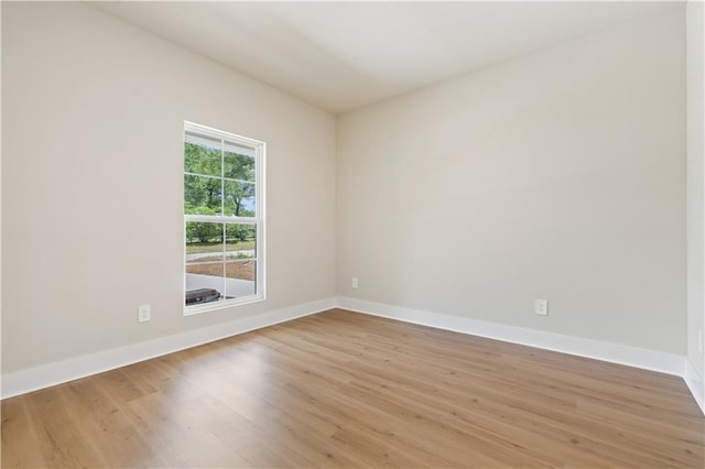 spare room with light wood-type flooring