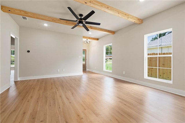 unfurnished room featuring ceiling fan, light hardwood / wood-style flooring, and beam ceiling