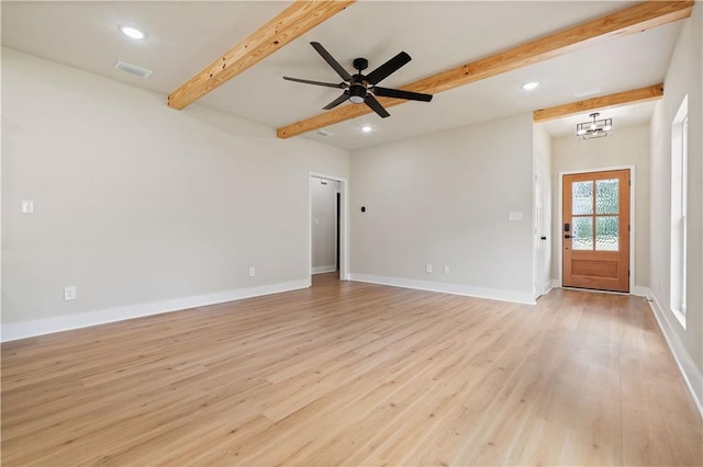 interior space featuring ceiling fan with notable chandelier, light wood-type flooring, and beamed ceiling