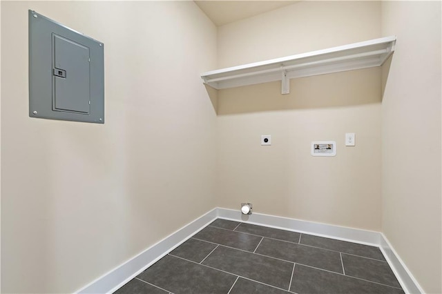 laundry area featuring electric panel, dark tile patterned floors, electric dryer hookup, and washer hookup