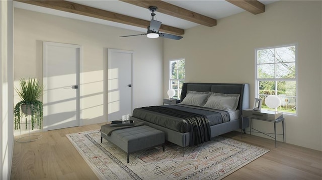 bedroom featuring ceiling fan, light hardwood / wood-style flooring, and beamed ceiling