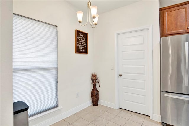1468 Surrey Loop, Foley, AL 36535 - dining space with a chandelier, light tile patterned floors, and baseboards