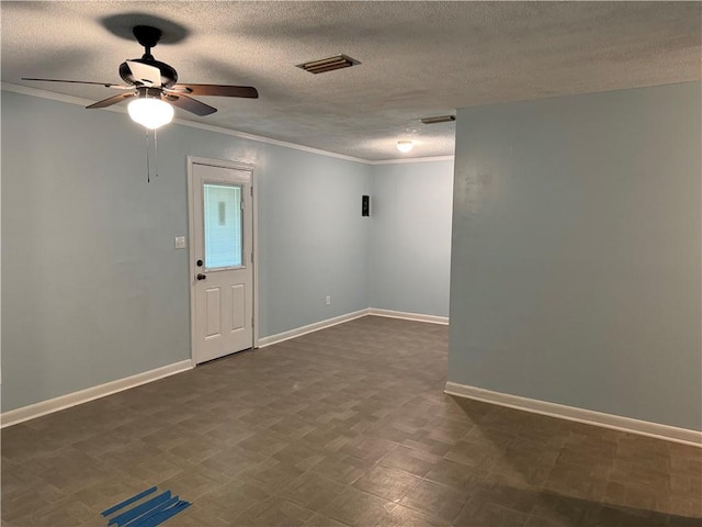 empty room with a textured ceiling, ornamental molding, and ceiling fan