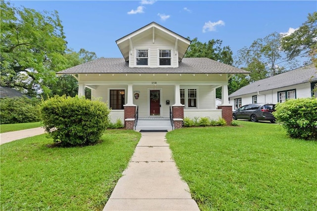 view of front of property featuring a front yard and a porch