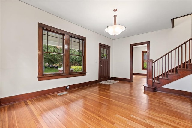 entrance foyer featuring hardwood / wood-style flooring