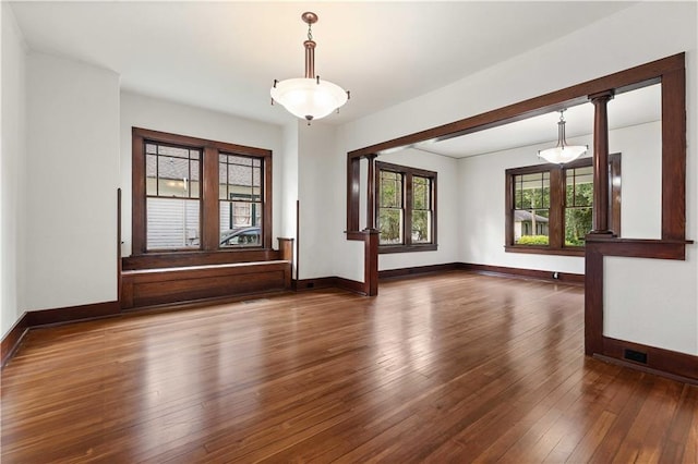 empty room with dark hardwood / wood-style floors