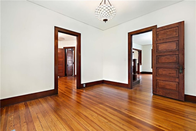 unfurnished room featuring hardwood / wood-style floors