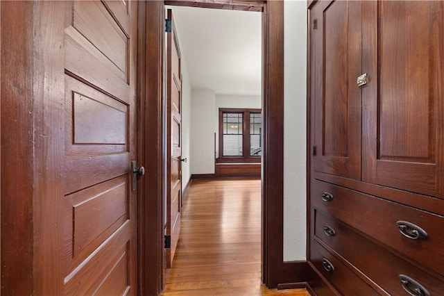 hall with light wood-type flooring