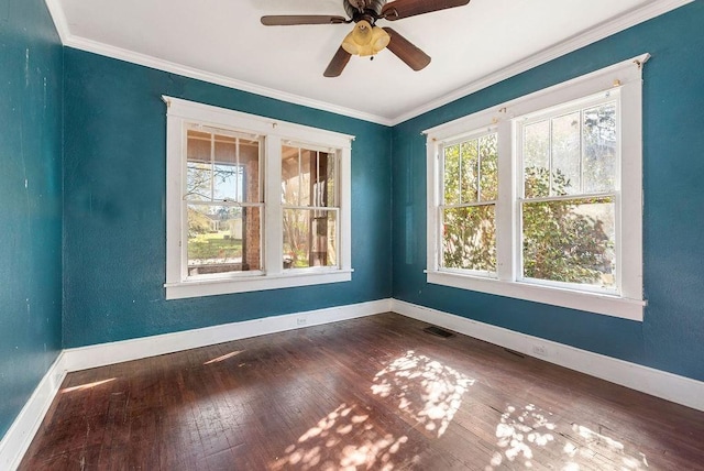 unfurnished room with baseboards, visible vents, and ornamental molding