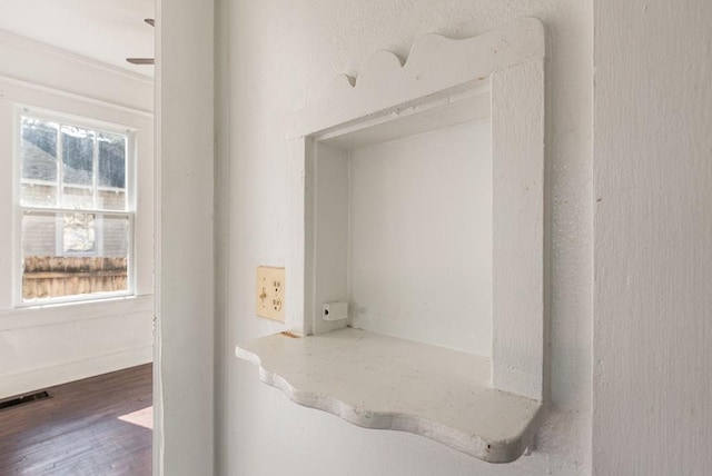 room details with visible vents and wood finished floors